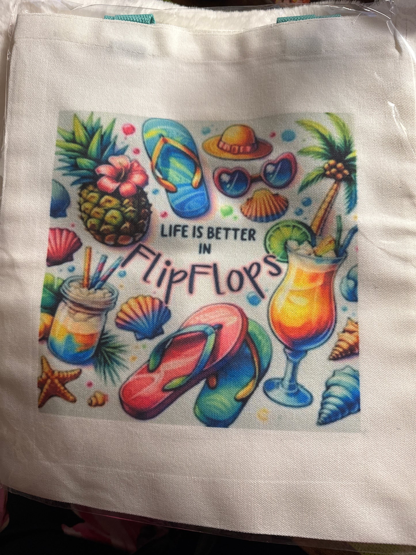 Tote bag with teal handles